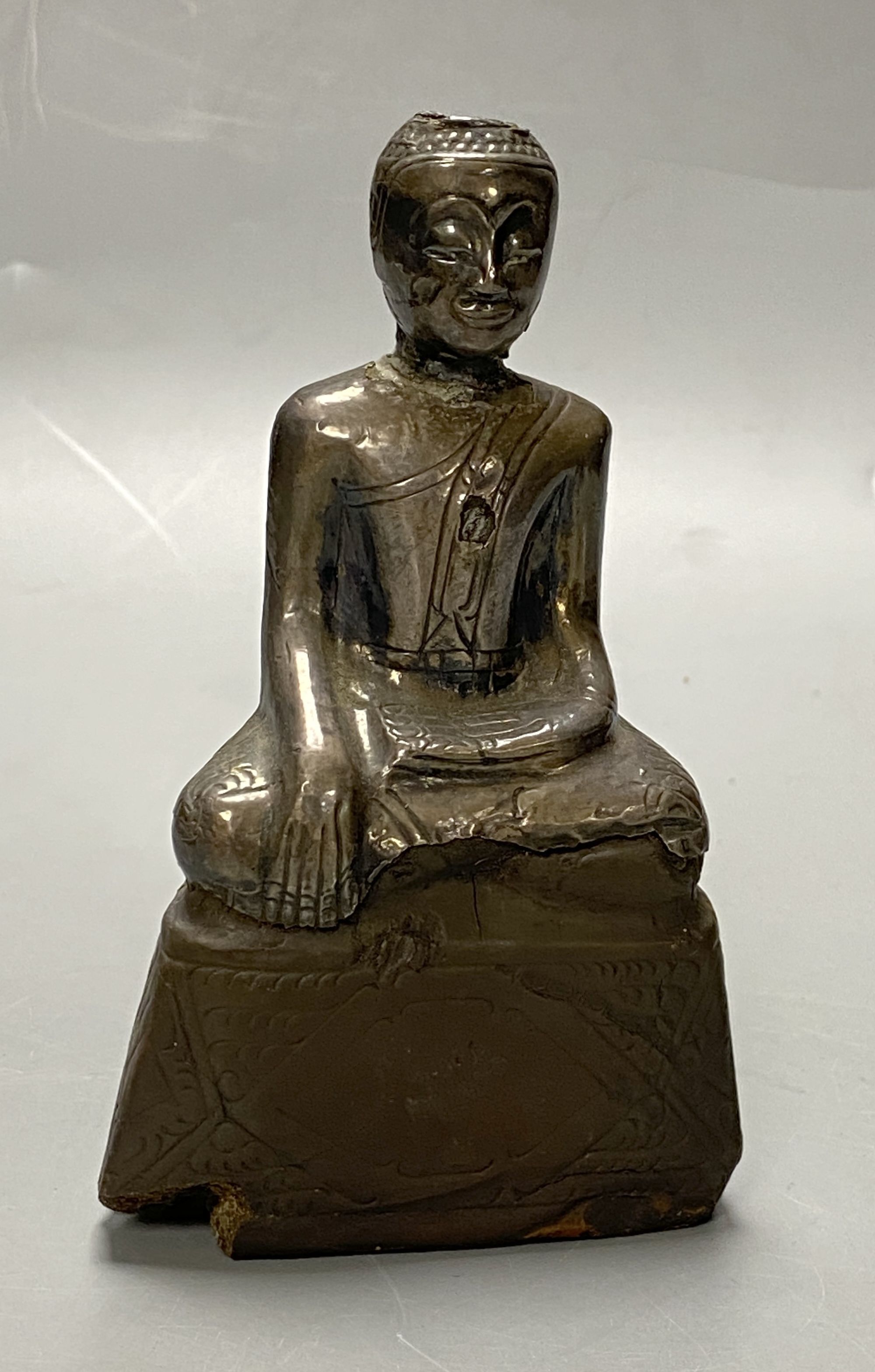 A 19th century Burmese silver overlaid wood figure of Buddha Shakyamuni, height 12cm